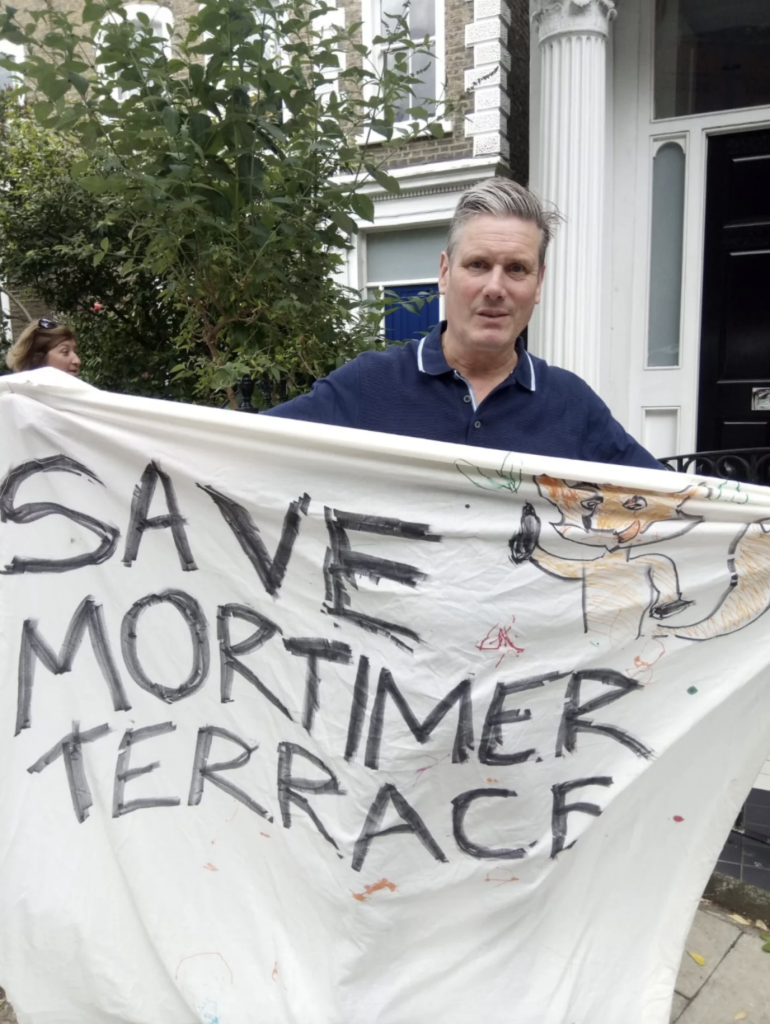 Keir Starmer, our MP at the time, with our Save Mortimer Terrace banner.
